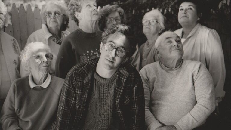 SXSW Review: ‘Beyond the Duplex Planet’ Finds Poetry, Humor, and Connection in Voices the World Often Overlooks David Greenberger and friends by Len Irish