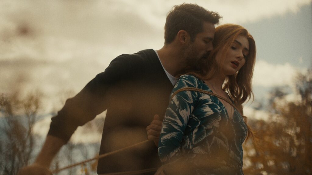 Brant Daugherty (left) and Emily Robinson in a scene from "By the Roots."