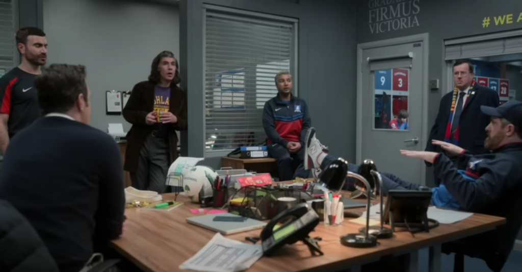The Diamond Dogs help Roy with his self-doubt, in a scene from the television series 'Ted Lasso'.